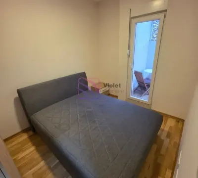 Bedroom with a double bed and access to the terrace. - image 12