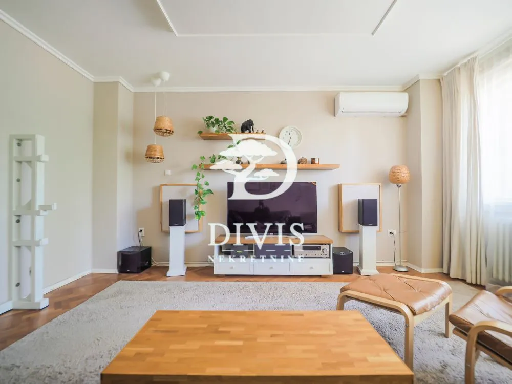 Living room with furniture, television and speakers.