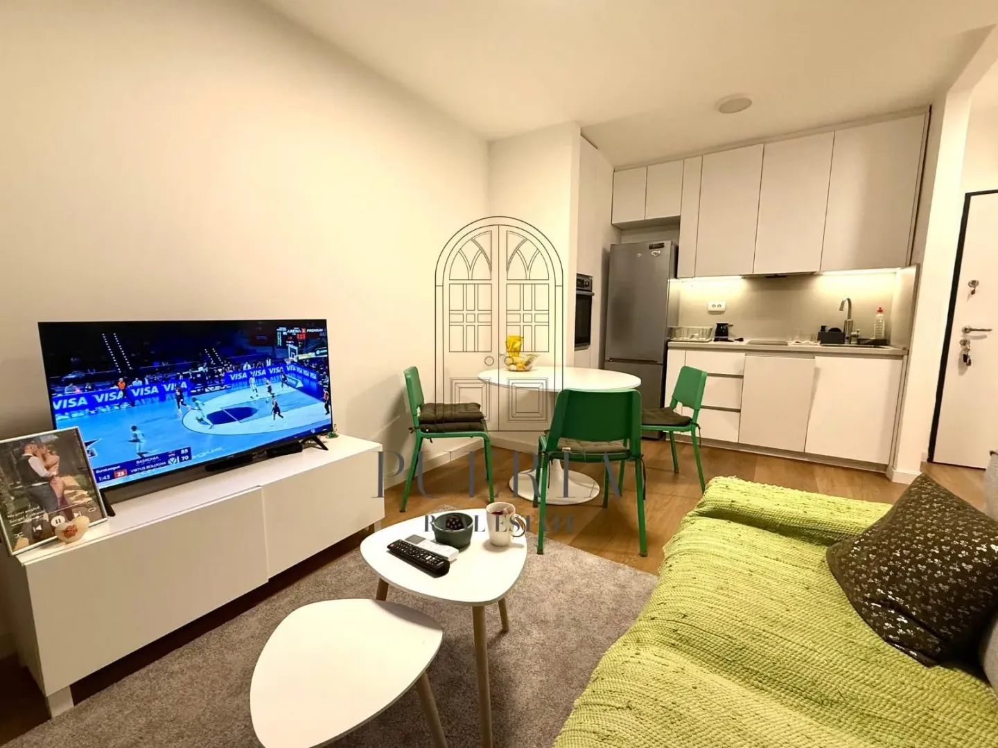 Living room connected with the dining area and kitchen.