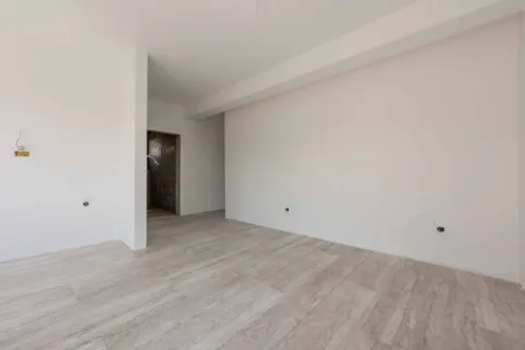 Empty room with white walls and tiled floor. - image 4