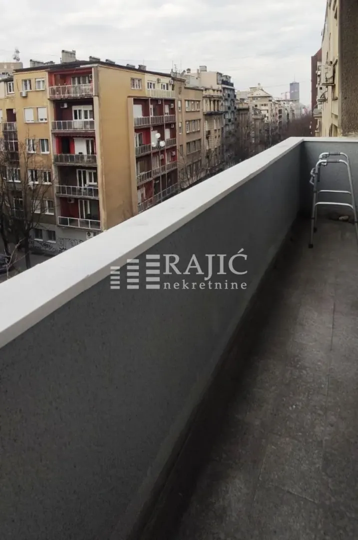 View from the balcony overlooking city buildings.