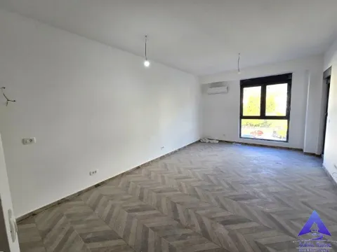 Empty room with white walls and wooden flooring. - image 4