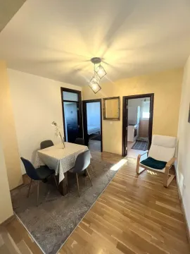 Living room with a dining table and chairs. - image 4
