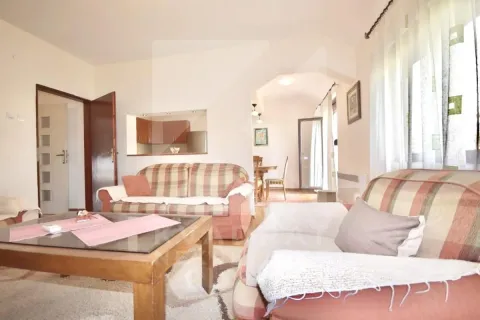 Living room with sofas and a table. - image 3
