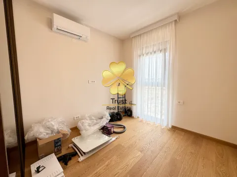 An empty room with hardwood flooring and an air conditioner, cluttered with items. - image 12