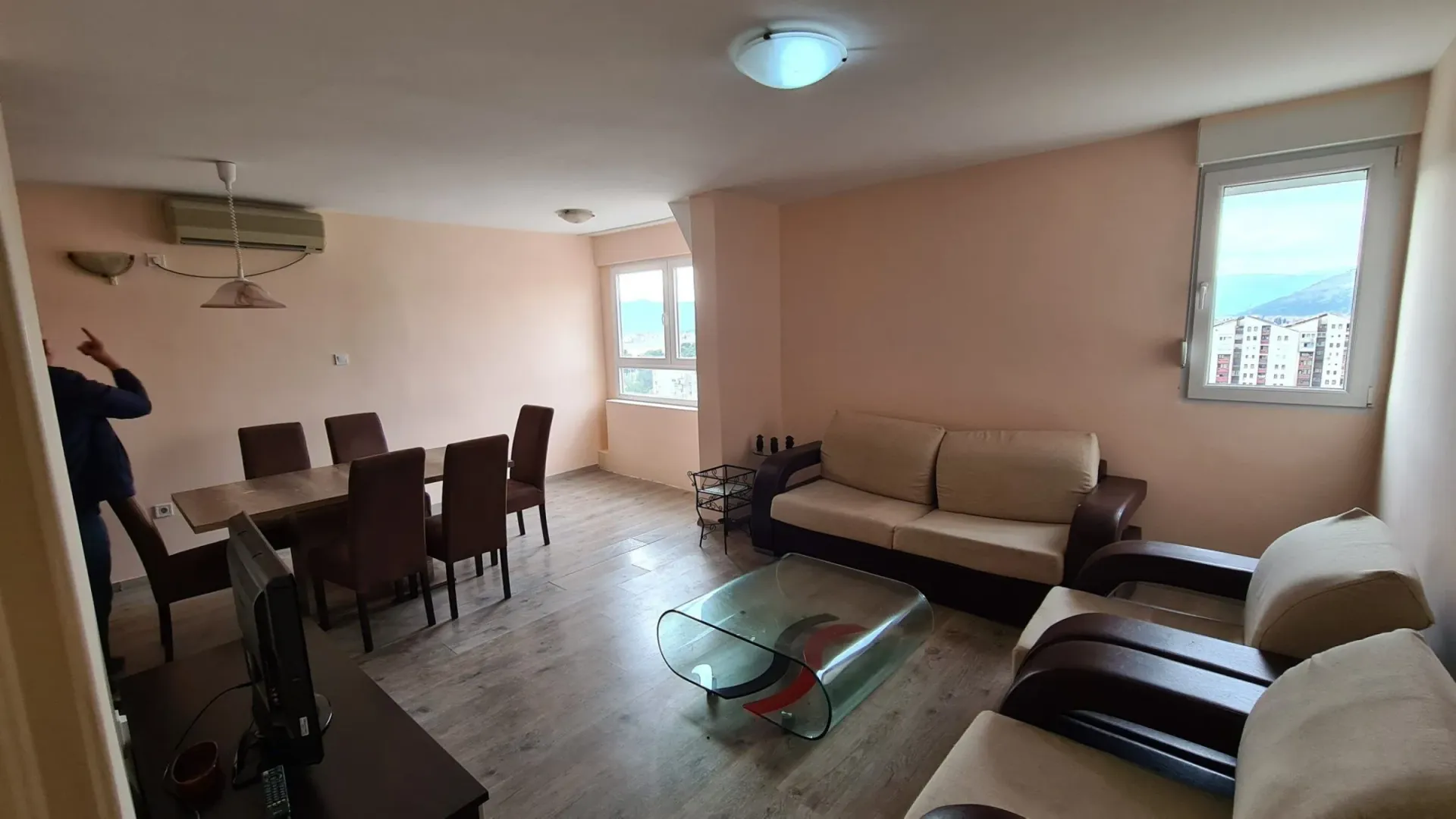 Spacious living room with a dining area and seating set.