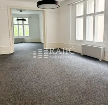 Empty spacious room with carpeting and large windows. - image 13