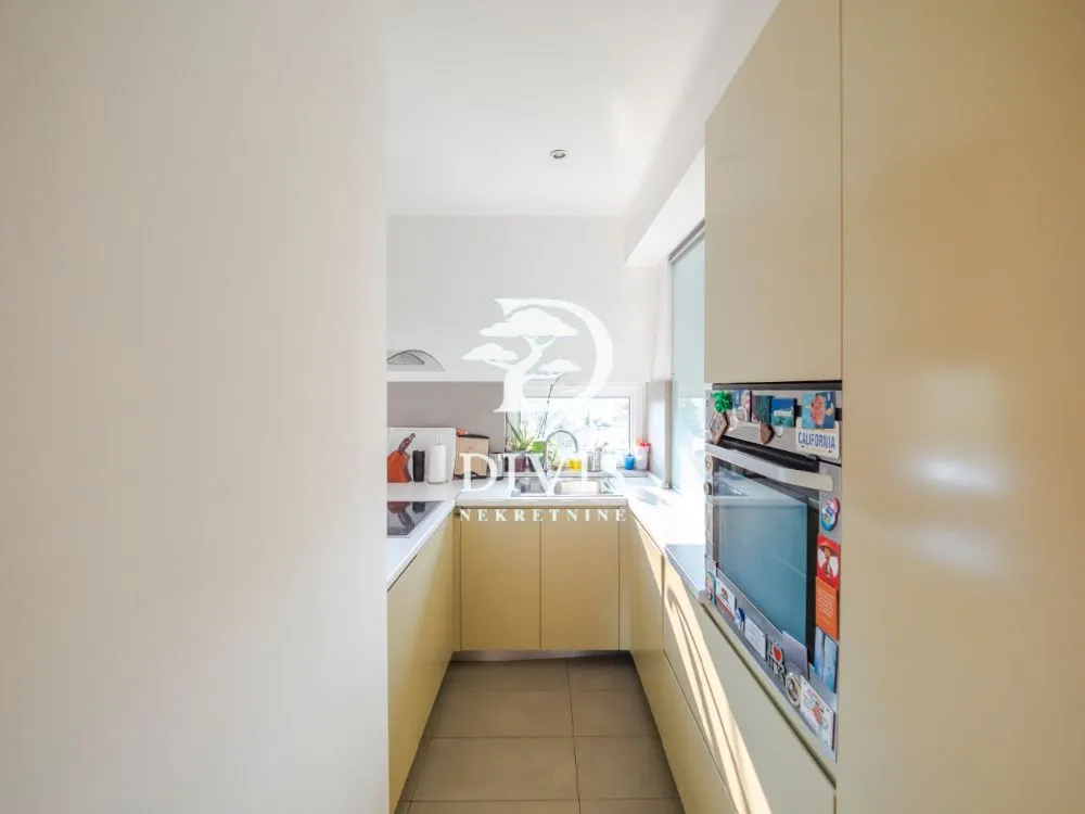 Small kitchen with built-in units and appliances.