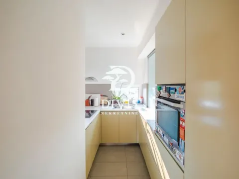 Small kitchen with built-in units and appliances. - image 14
