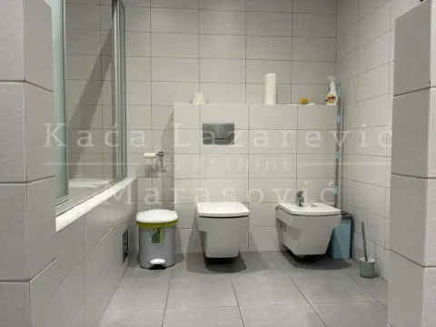 Modern bathroom equipped with sanitary ware and a shower cabin. - image 13
