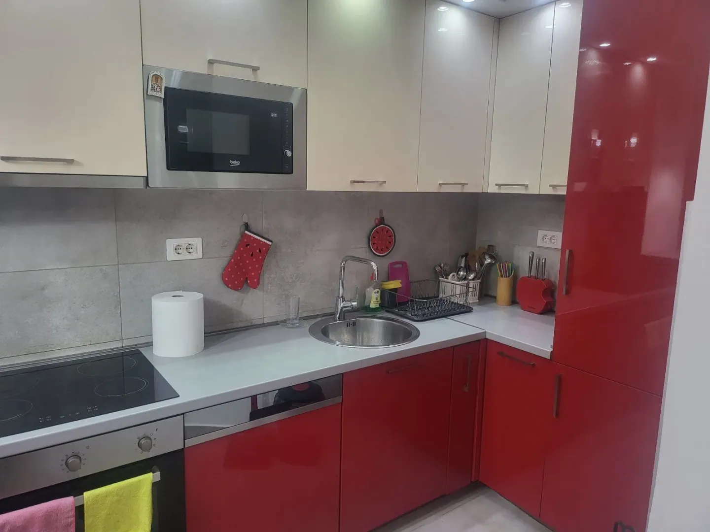 Kitchen with red and white cabinets.