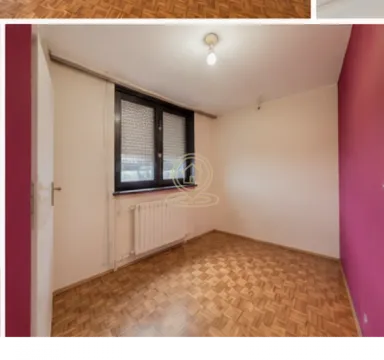 Prazna soba sa parketom i roze zidovima. - image 4