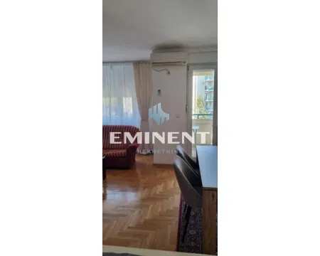 Living room with dining area and balcony access. - image 2