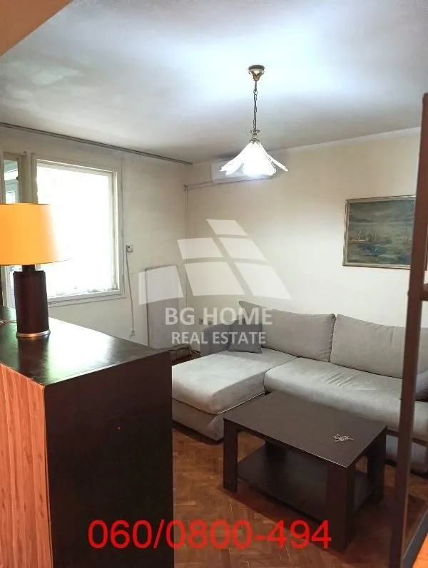 Living room with a sofa and a coffee table.