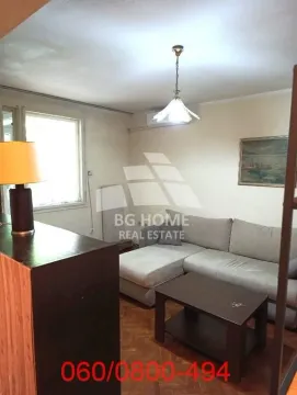 Living room with a sofa and a coffee table. - image 3