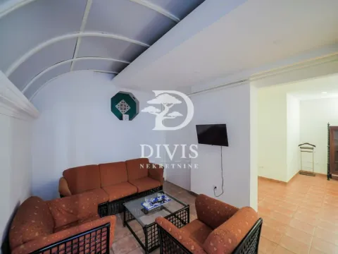 Living room with a seating set and a wall-mounted TV. - image 11