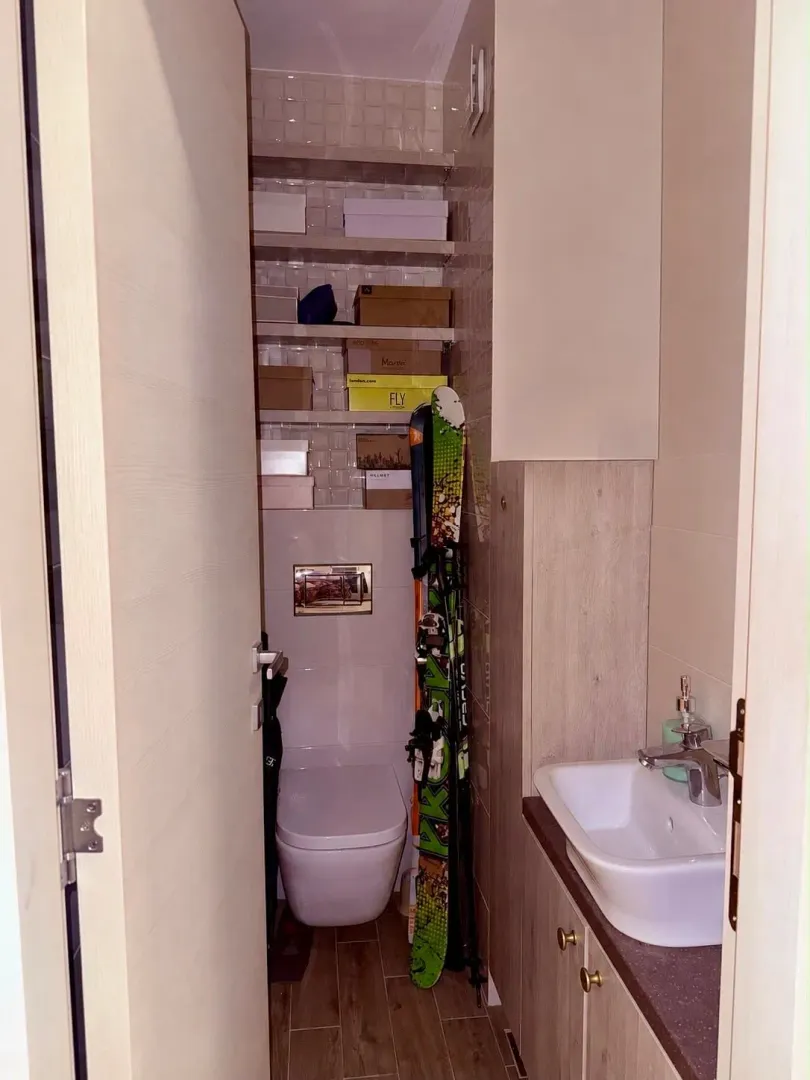 Small bathroom with a sink and toilet.