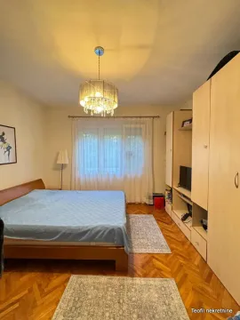 Furnished bedroom with a double bed, wardrobe, and a window. - image 5