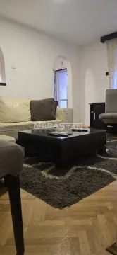 Living room with sofa and coffee table. - image 2