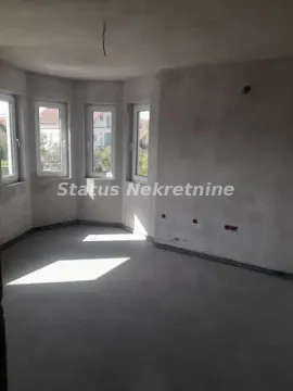 Unfinished room under construction with plastered walls and windows. - image 4