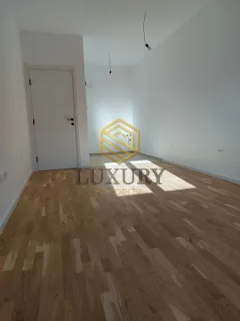 Empty room with parquet flooring and white walls. - image 3