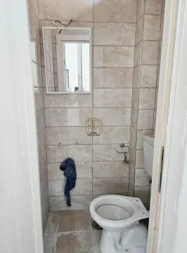 View of the bathroom with a toilet bowl and a wall mirror. - image 5