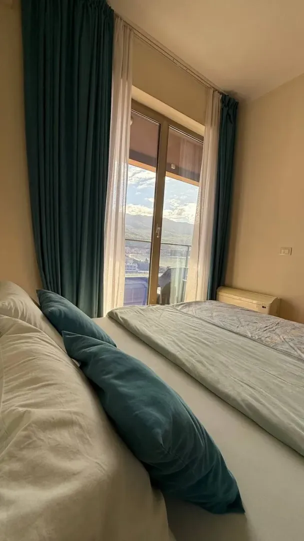 Comfortable bedroom with a double bed and a sea view.
