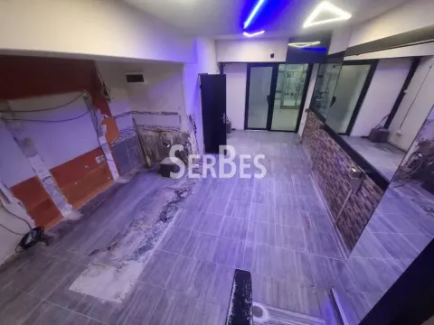 Empty room under renovation with tiled floor and walls prepared for work. - image 6