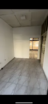 An empty room with tiled flooring. - image 2