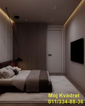 Moderna spavaća soba sa bračnim krevetom, ugradnim ormarom i televizorom na zidu. - image 2