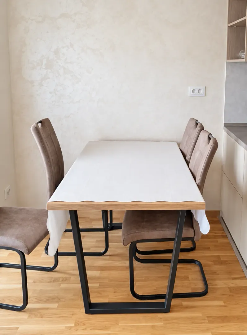 Dining table with chairs in a modern kitchen.