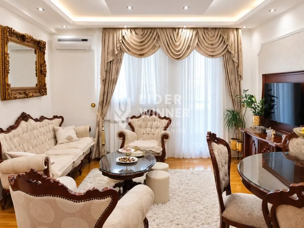 Classic furnished living room with a sofa set and a dining table.