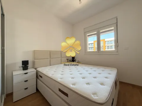 Bright bedroom with a double bed and a nightstand. - image 12