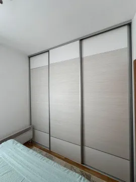 Bedroom with a large built-in wardrobe. - image 7
