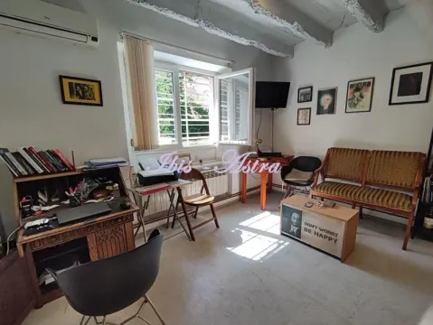 Living room with a desk and seating set. - image 4