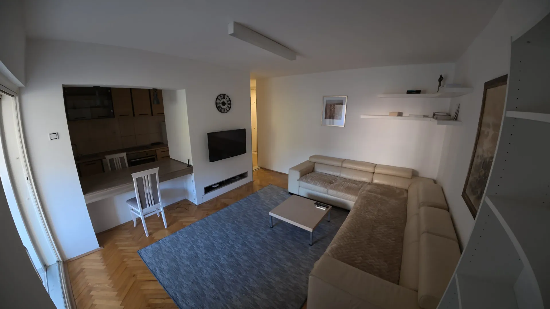 Spacious living room with a sectional sofa and dining area.