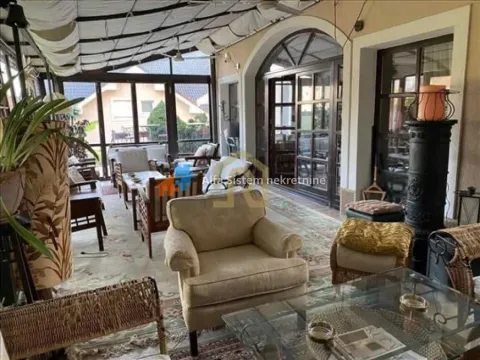 Enclosed terrace with seating furniture and a view of the surroundings. - image 5