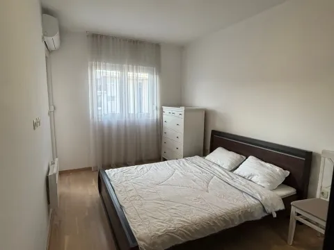 Furnished bedroom with a double bed, white chest of drawers, and a window with curtains. - image 5