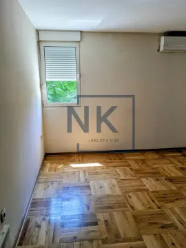 Empty room with parquet flooring and a window. - image 4