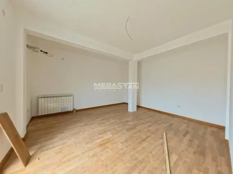 Empty room with hardwood flooring and a radiator. - image 20