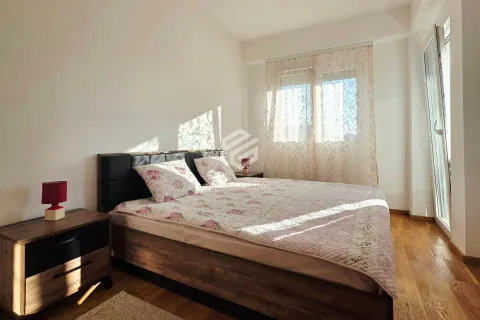 Bedroom with a double bed, bedside tables, and a window. - image 20