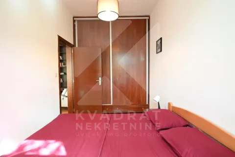 Bedroom with a double bed and a built-in wardrobe. - image 11