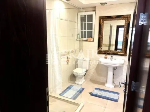 A clear bathroom with a shower cabin, washbasin, and toilet. - image 8