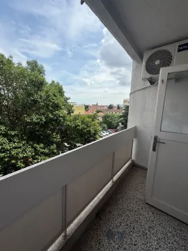View from the balcony overlooking the neighborhood and greenery. - image 3