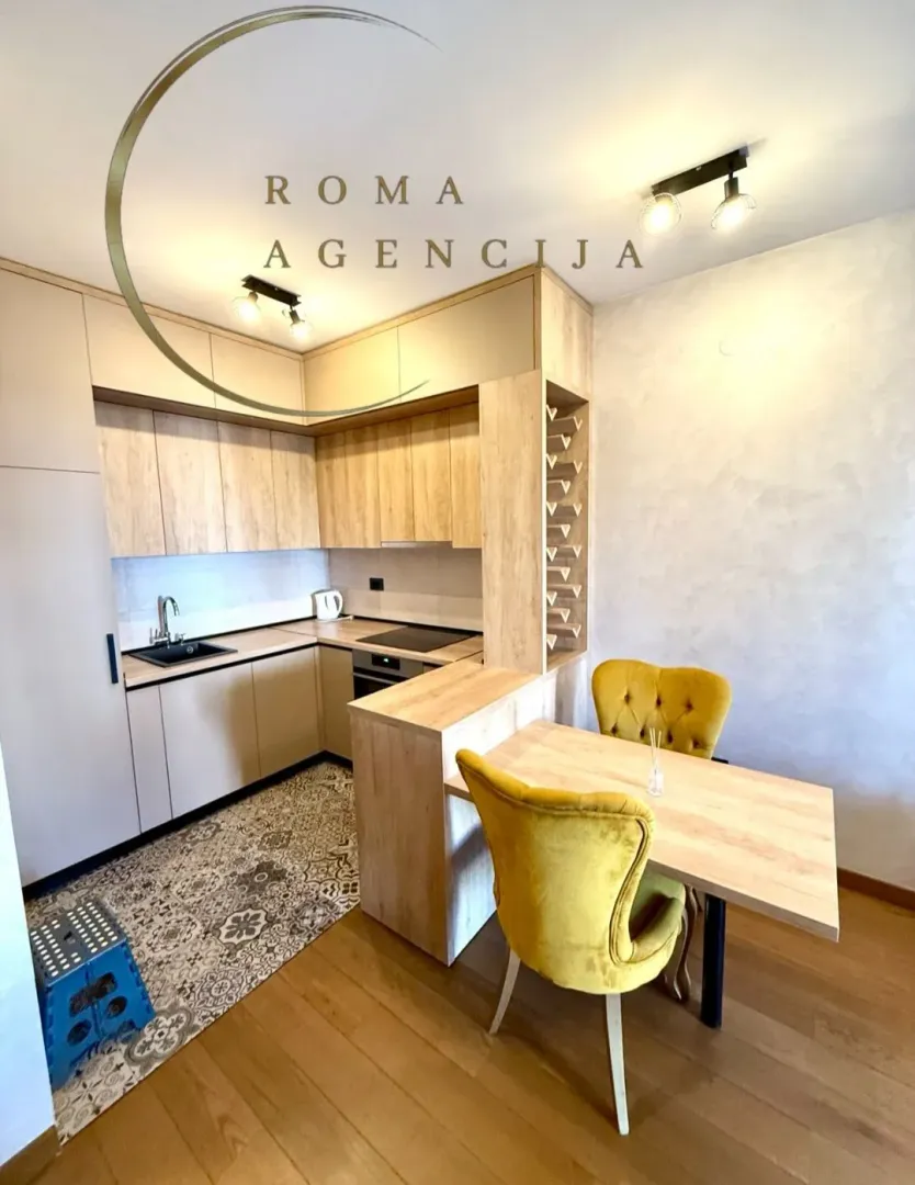 Modern kitchen with a dining table and yellow chairs.