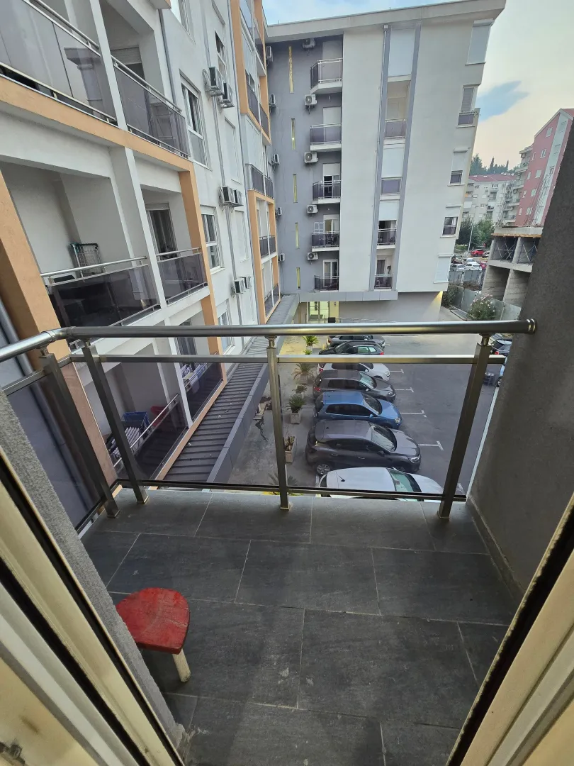 View from the balcony overlooking the building and parking lot.