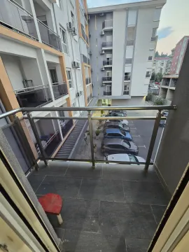 View from the balcony overlooking the building and parking lot. - image 5