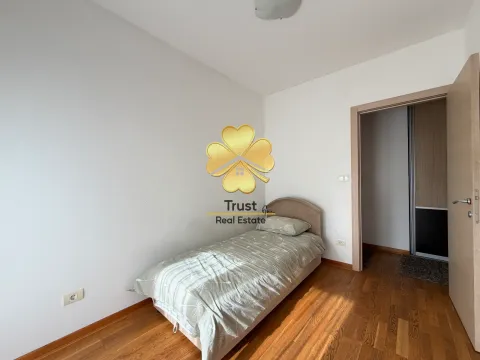 Small bedroom with a bed and wooden flooring. - image 22