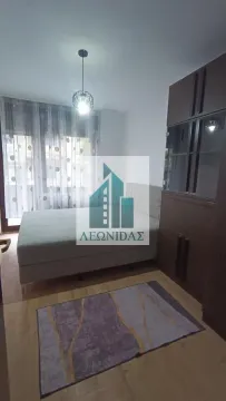 Furnished bedroom with a double bed, wardrobe, and a rug. - image 6