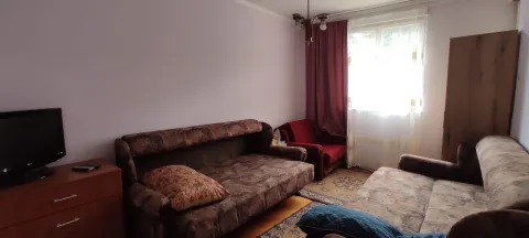 Living room with a sofa set and a television. - image 7